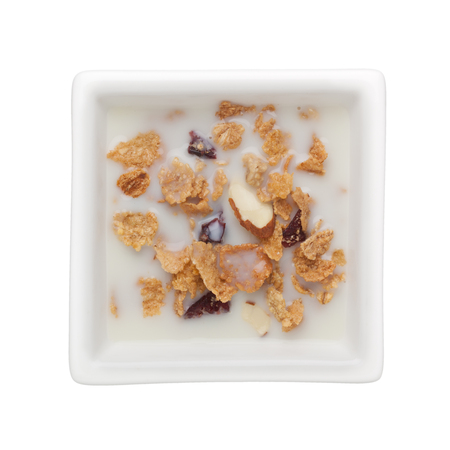 Cornflakes with milk in a square bowl isolated on white background