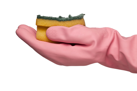 Hand in pink rubber glove holding a grungy dish sponge isolated on white background