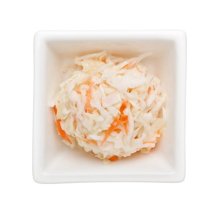 Coleslaw salad in a square bowl isolated on white background
の写真素材