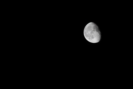   Partial moon, isolated on black  