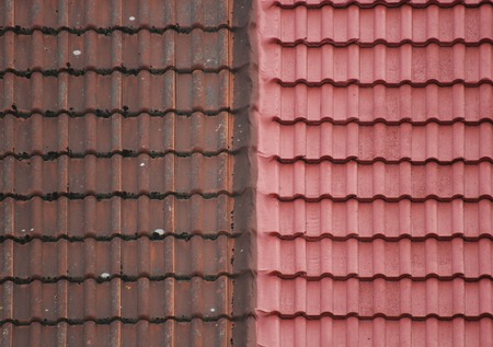   Old and new roof tiles side by side.の写真素材