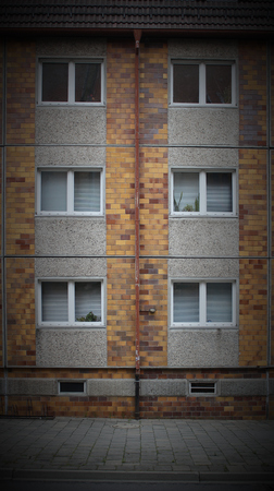   Typical windows in a plattenbau style building from eastern Germany. The Street can be seen at the ground. Vignetting was applied.の写真素材