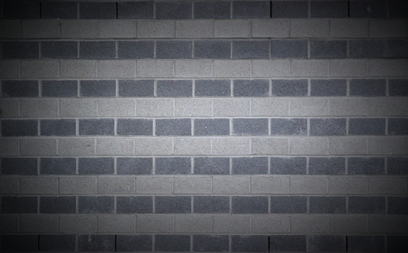   Wall made from rows of white and gray bricks usable as background or texture. Vignetting was...