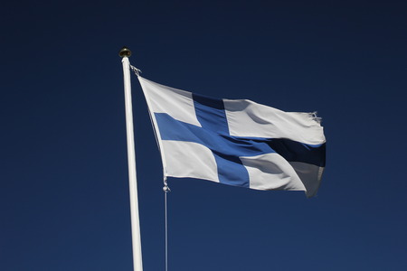 Flag of Finland on dark blue sky.の写真素材