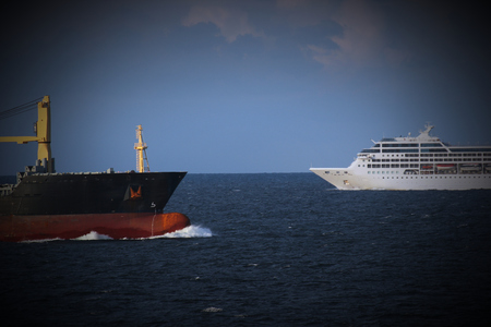 Ferry and freight ship facing in open waters.の写真素材