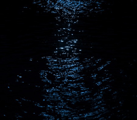 Blue light effect on water in hourglass shape.の写真素材