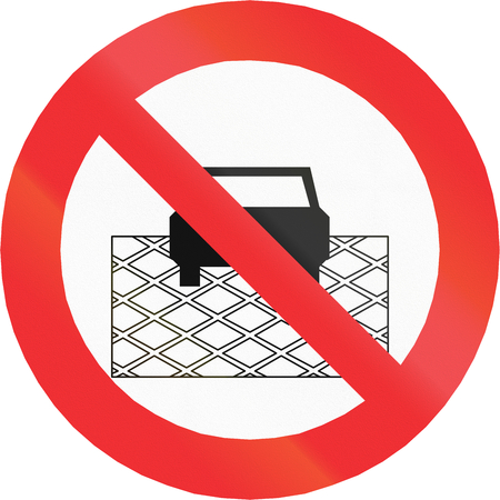 Regulatory road sign in Chile: No stopping on checkered pavement.の写真素材