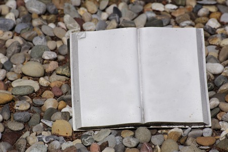 A simple stone book ready for custom text to be inserted.の写真素材