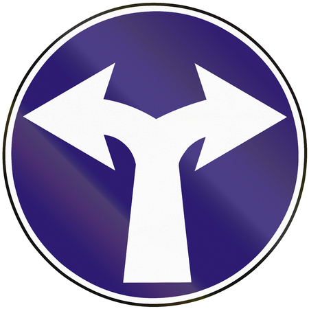 Road sign used in Slovakia - Turn right or left.の写真素材