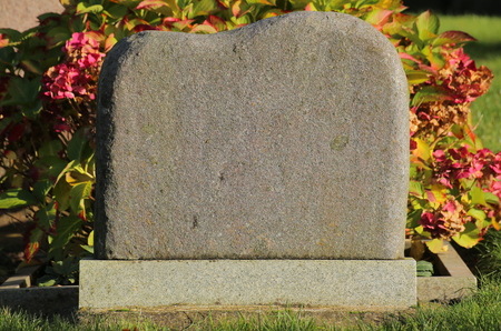 Tombstone with sunlight from the right side.