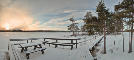 Bench, pier and island at lake Alebosjoen in Sweden.の写真素材
