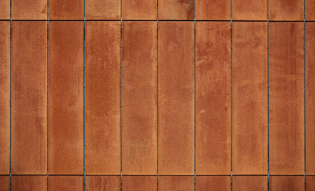 Rusty steel panels on a modern building.