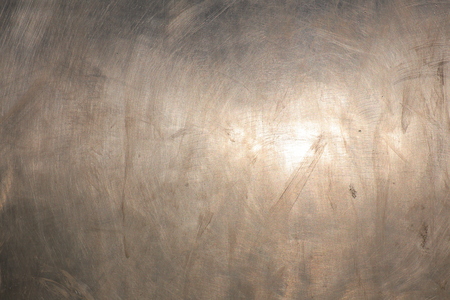 Bright shot of sunlight reflection on brushed metal surface.の写真素材