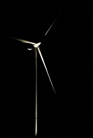 Conceptual low key shot of wind power station.の写真素材
