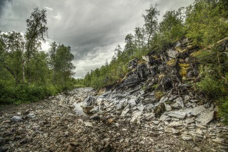 River bed of the stream Renselelva near the cave Marmorgrottan in Norway.の写真素材