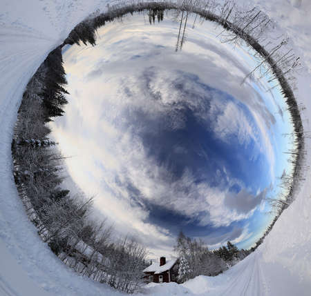 Low angle panorama of sky over remote house in Swedish Lapland.の写真素材