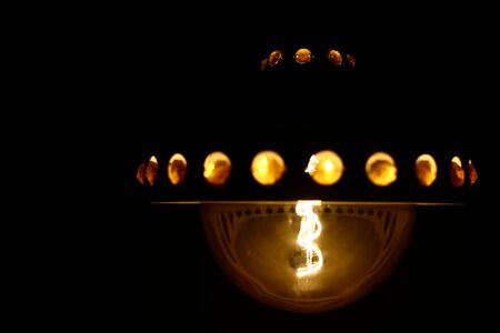 LED filament globe resembling an old carbon filament light bulb.の写真素材