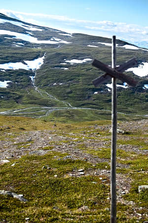 A marked trail on the barren plains near mount Nuolja, Lapland. The stream Gohpasjohka can be seen in the valley.の写真素材
