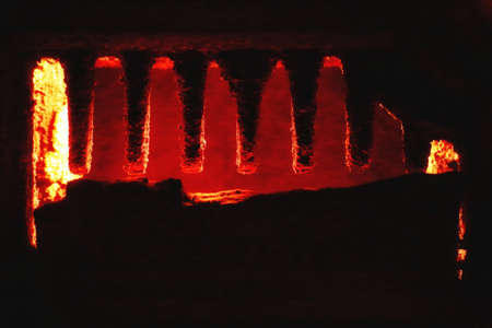 Detail of sooty rack inside an old furnace.