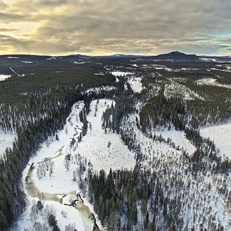 Drone shot of the frozen river Petikan in Swedish lapland.の写真素材