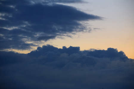 Blue cumulus clouds on a summer evening.の写真素材