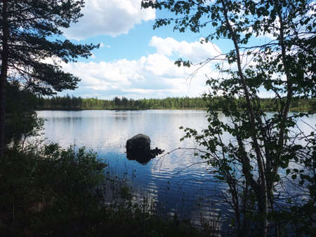 View over a small lake in Swedish Lapland.の写真素材