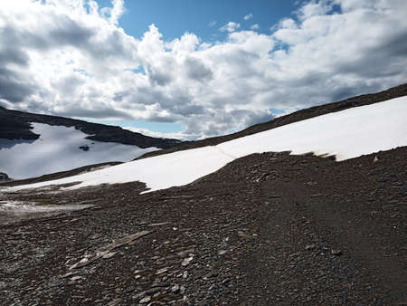 Path over glacier and barren landscape on northern Swedish mountains.の写真素材