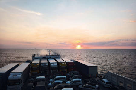 View from car ferry in the Baltic Sea at sunrise.の写真素材