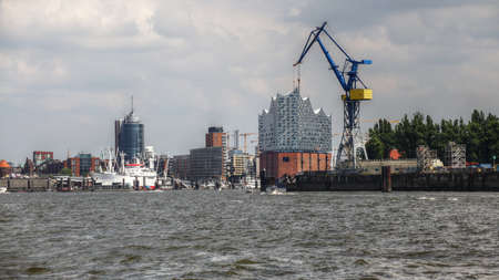 View over industrial port and cityscape of Hamburg.