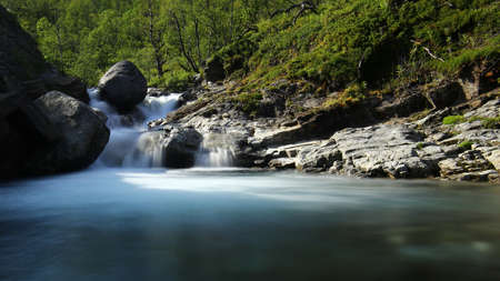 Long exposure shot of rapids in the stream Gohpasjohka in Swedish Lapland.の写真素材