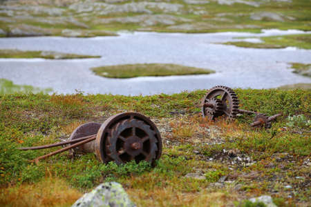 Rusty machinery parts in the abandoned Kuokkel mining field in Sweden.の写真素材