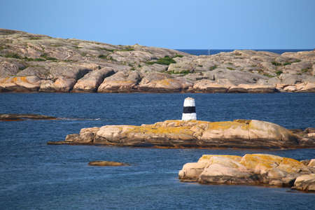 Rock cairn marking the waterway at the rocky coast of Smogen in Sweden.の写真素材