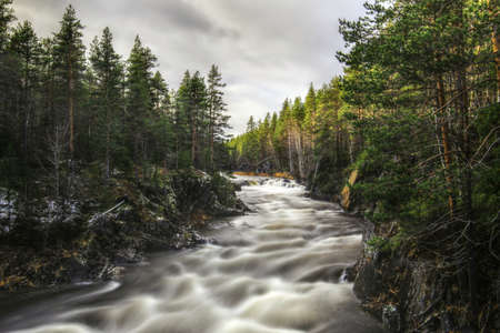Long exposure shot of Mala river in Mala-Storforsens nature reserve in Sweden.の写真素材