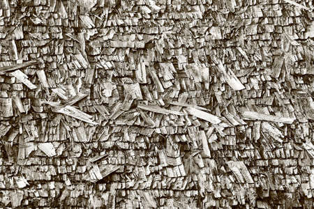 Black and white shot of broken wood shingle texture.の写真素材