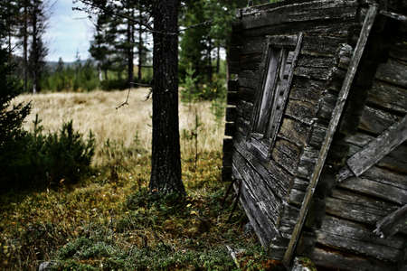 Broken and weathered house in northern Sweden.の写真素材
