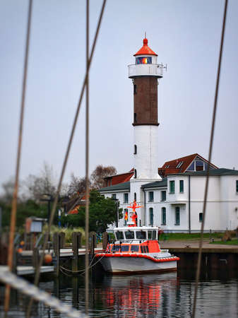 Port with lighthouse and defocused ropes in Timmendorf.の写真素材
