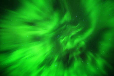 Magical upward shot of northern lights on starry sky.の写真素材
