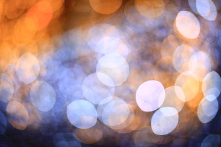 Beautiful bokeh of defocused blue and yellow christmas decorations.の写真素材