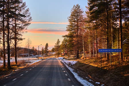 Beautiful sunset in the small town Granbergstrask in northern Sweden.の写真素材
