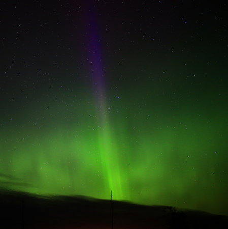 Northern lights in Lapland with a single blue spike.の写真素材