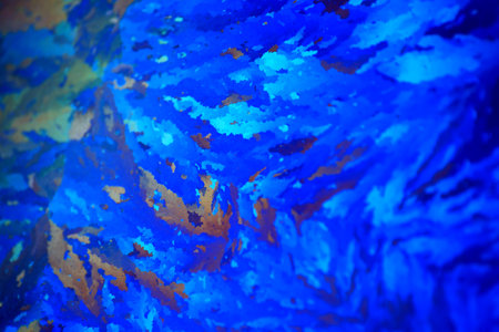 Abstract colorful light effects on window frost, macro in blue and orange.の写真素材