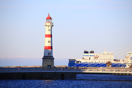 Lighthouse, bridge and ferry at harbor of Malmo in Sweden.の写真素材