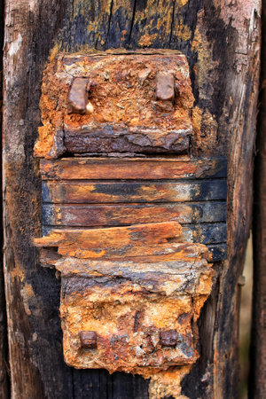 Close up of old weathered railway sleeper fastening.の写真素材