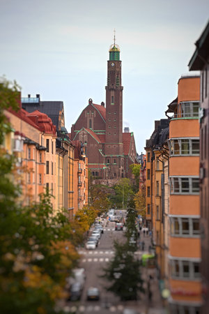 Engelbrekt church view over Stockholm street with colorful buildings, autumn trees and blurred foreground.の写真素材