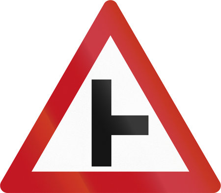 Warning road sign - side junction to the right.の写真素材