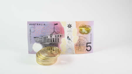 Background with Bitcoin cryptocurrency coins and Australian Dollar dollar. Bitcoin cryptocurrency...