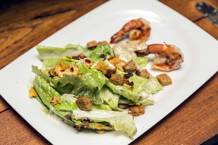 Salad with bread bacon and shrimps, selective focus.の写真素材