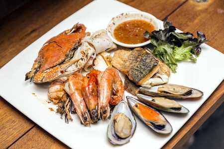 Grilled seafood dishes in a dish with Thai spicy sauce.の写真素材