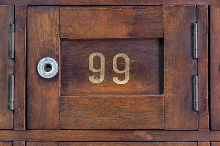 Close up Old wooden Post Box with number 99の写真素材