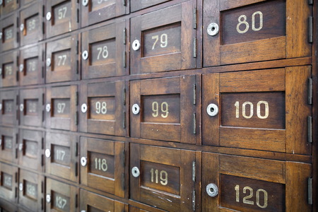 Old wooden Post Box with numbers selective focus.の写真素材